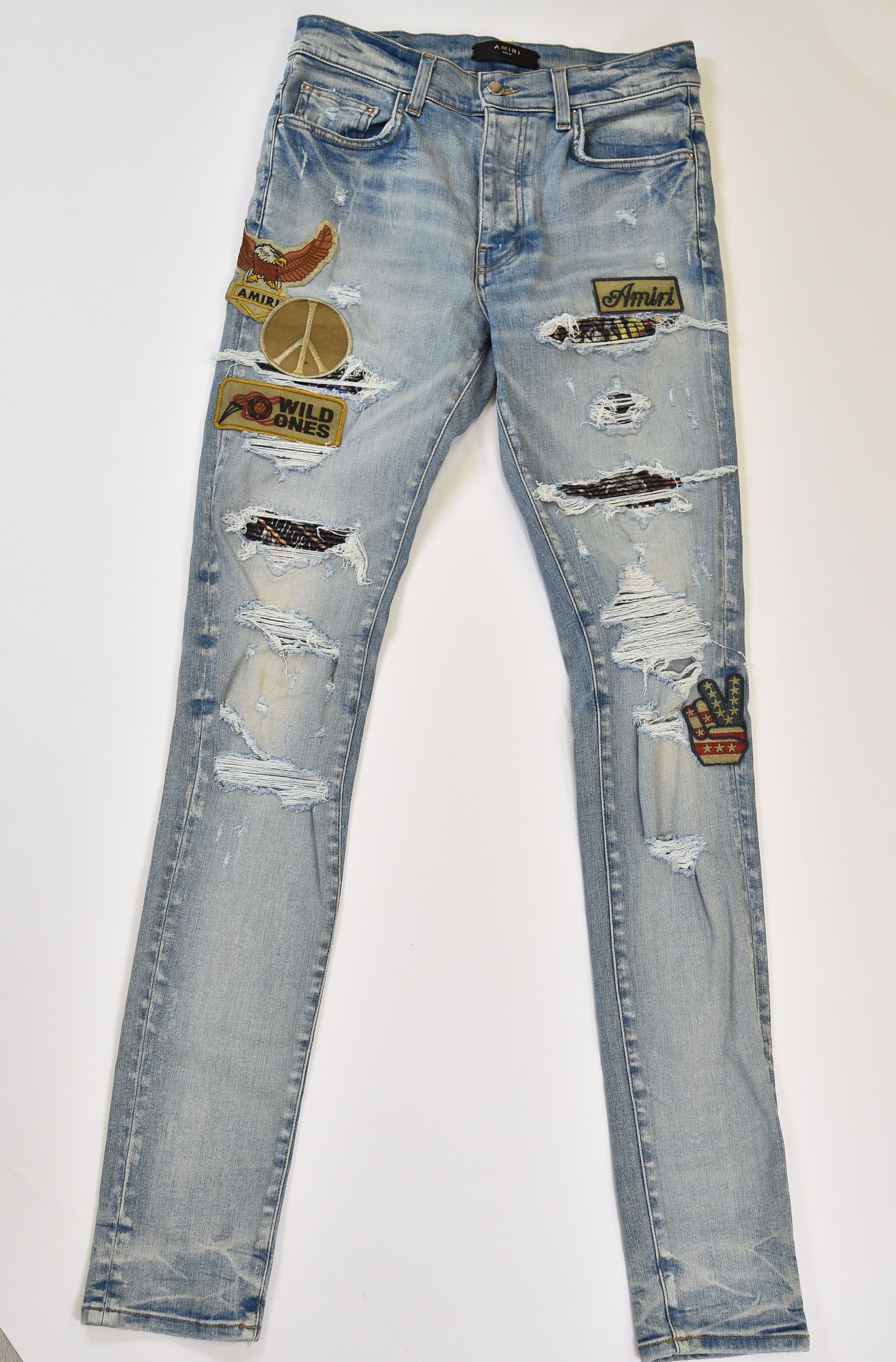 Amiri MX1-Style Distressed Skinny Jeans with Patchwork Appliqué (Eagle / Peace / Wild Ones) - Image 1